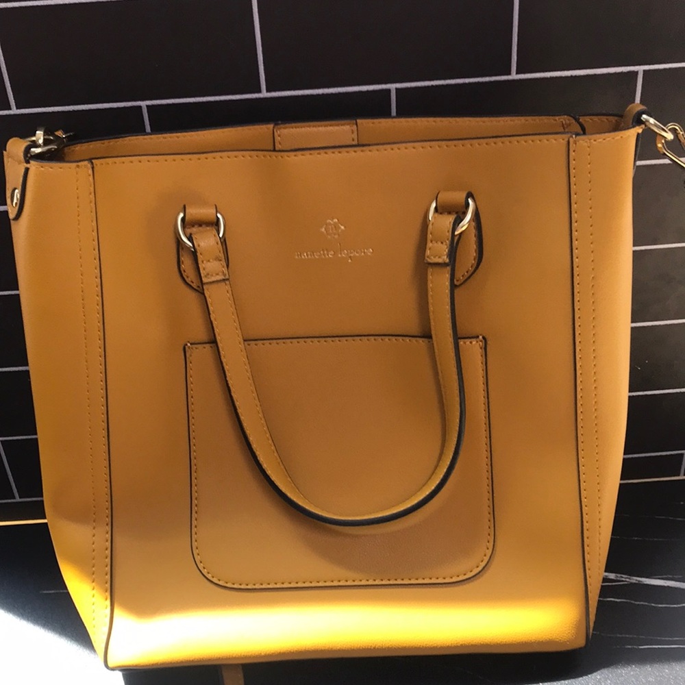 Gorgeous mustard color Nanette Lenore bag with hand sanitizer holder. EUC!